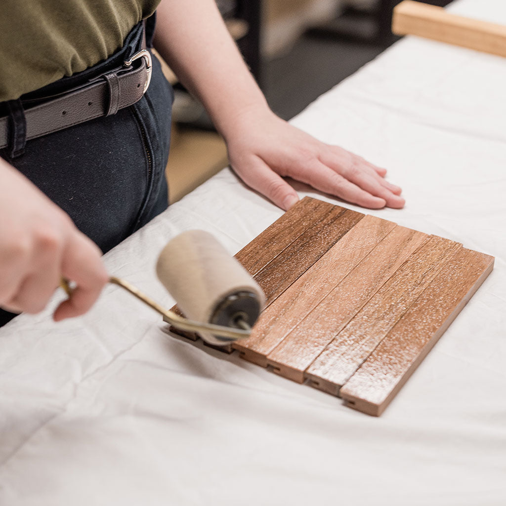 In the workshop at Corner Block Studio oiling our recycled Australian hardwood timber frames.